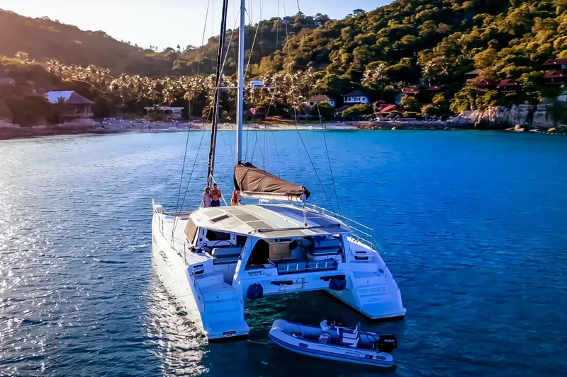 Ruby Rose 2 Yacht Photos Pics 2023 Seawind 1370 catamaran anchored in a scenic tropical bay.