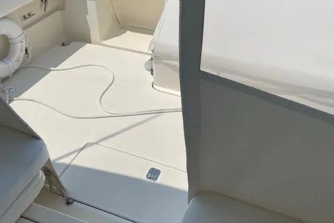 "moxie" Yacht Photos Pics 1998 Tiara Yachts 35 Open Hardtop interior with white seating and deck.