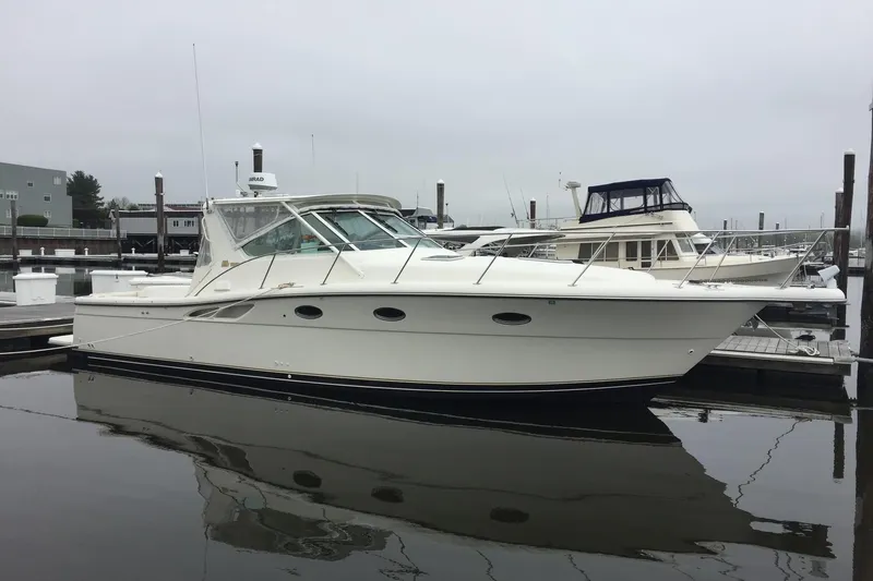 "moxie" Yacht Photos Pics 1998 Tiara Yachts 35 Open Hardtop docked at marina, side view.
