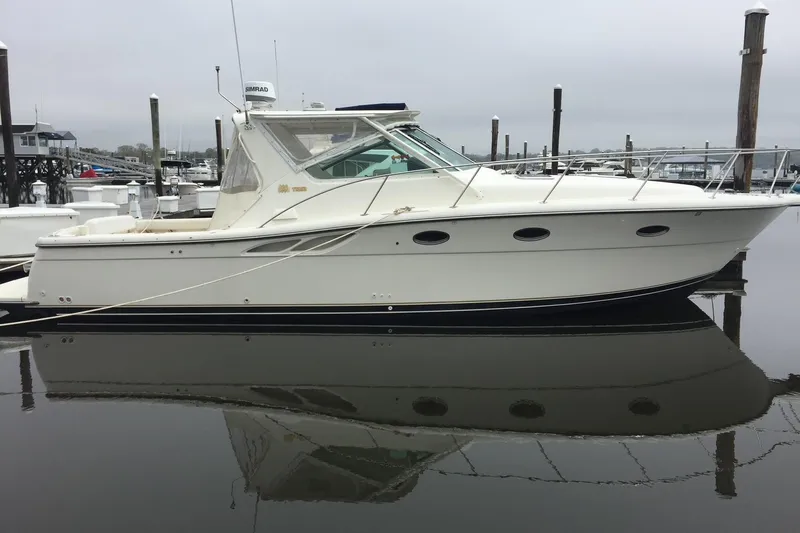 "moxie" Yacht Photos Pics 1998 Tiara Yachts 35 Open Hardtop docked in a marina, side view.