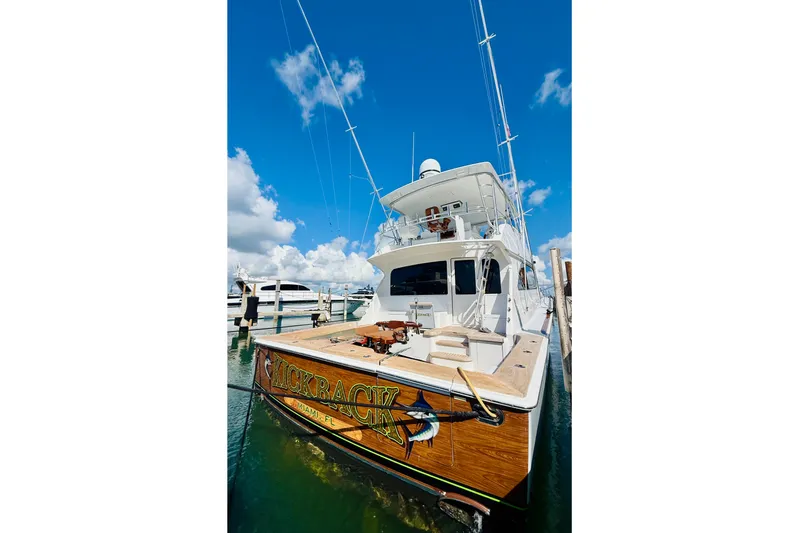 Kickback Yacht Photos Pics 2004 Viking 65 Convertible yacht docked under a clear blue sky.