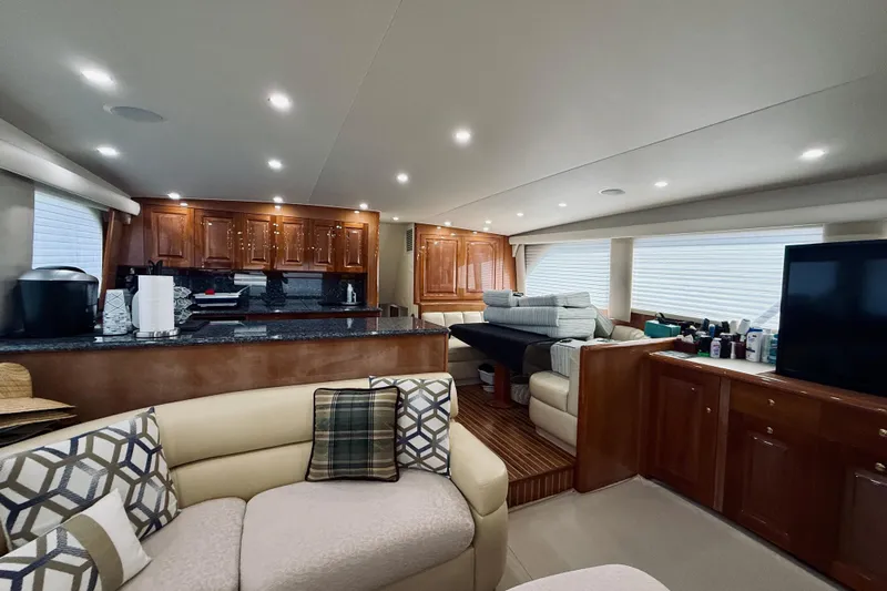 Kickback Yacht Photos Pics Luxurious interior of a 2004 Viking 65 Convertible yacht with modern amenities.