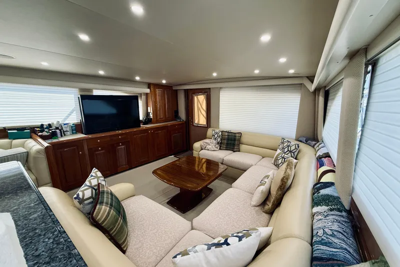 Kickback Yacht Photos Pics Luxurious interior of 2004 Viking 65 Convertible yacht with plush seating and modern amenities.