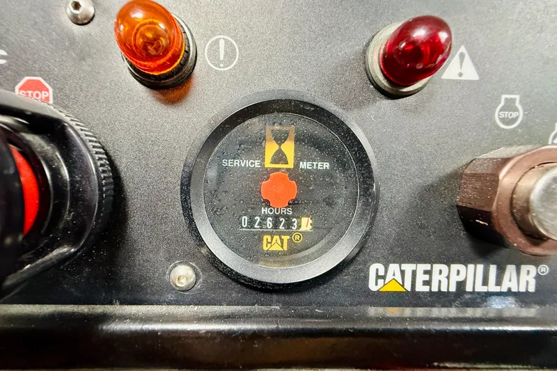 Kickback Yacht Photos Pics Caterpillar service meter displaying 2623 hours on a control panel with warning lights.