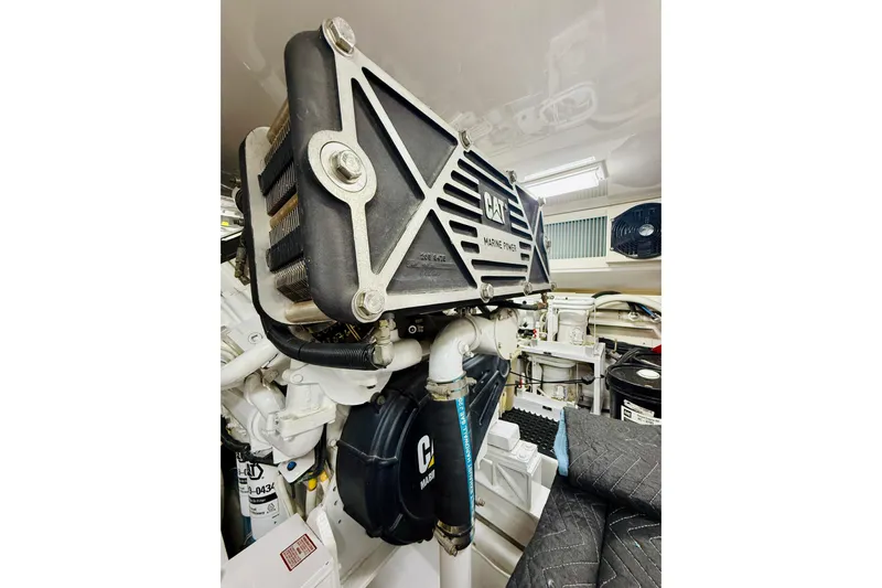 Kickback Yacht Photos Pics Engine room of 2004 Viking 65 Convertible with CAT marine power components.
