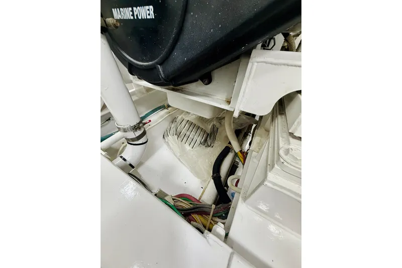 Kickback Yacht Photos Pics Engine compartment of 2004 Viking 65 Convertible boat, featuring Marine Power components.