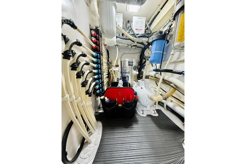 Kickback Yacht Photos Pics Engine room of 2004 Viking 65 Convertible yacht with organized piping and equipment.