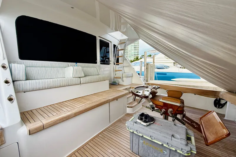 Kickback Yacht Photos Pics Luxurious 2004 Viking 65 Convertible yacht interior with seating and fishing equipment.