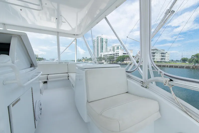  Yacht Photos Pics Luxurious interior of 2006 Hatteras 64 Convertible yacht with waterfront view.