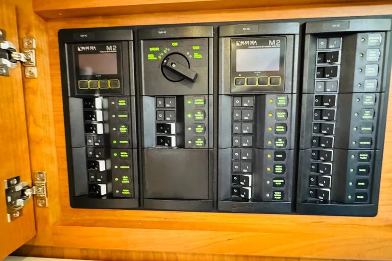  Yacht Photos Pics Electrical control panel on 2025 Back Cove 34O boat, featuring multiple switches and displays.