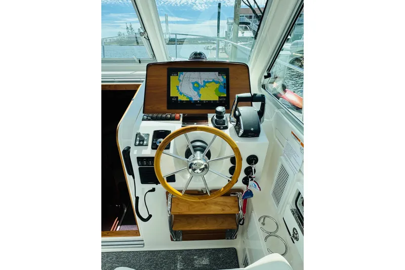  Yacht Photos Pics Helm of 2025 Back Cove 34O boat with navigation screen and steering wheel.
