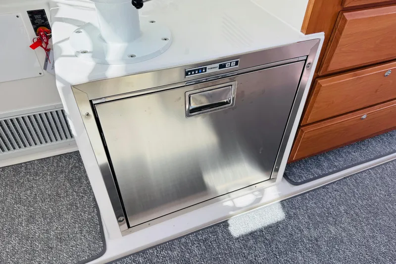  Yacht Photos Pics Stainless steel appliance on 2025 Back Cove 34O boat, next to wooden drawers.