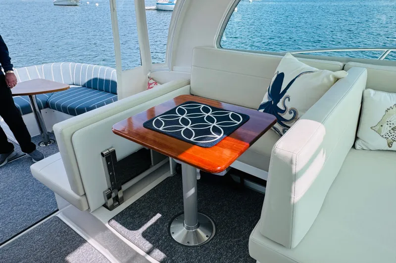  Yacht Photos Pics Luxurious interior of 2025 Back Cove 34O yacht with elegant seating and nautical decor.