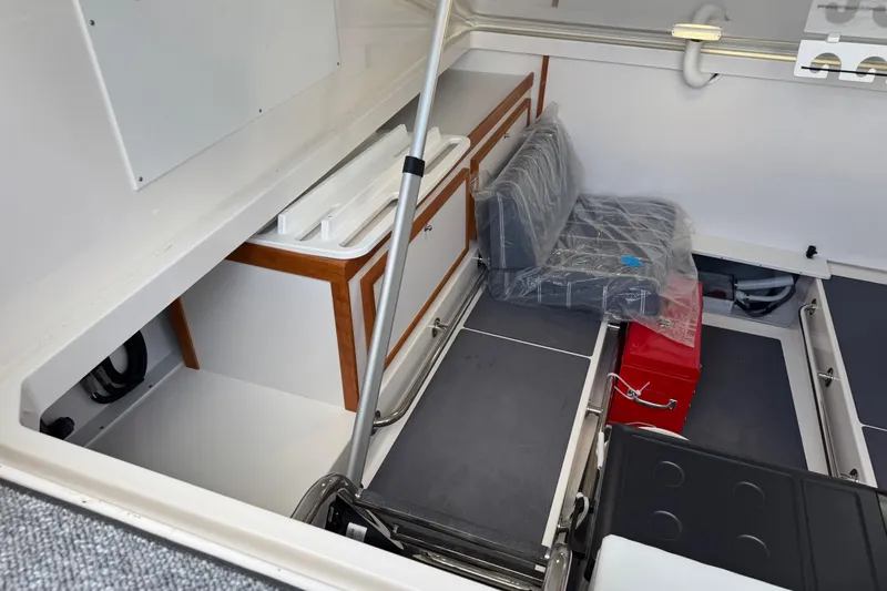  Yacht Photos Pics 2025 Back Cove 34O boat interior storage area with seating and equipment.