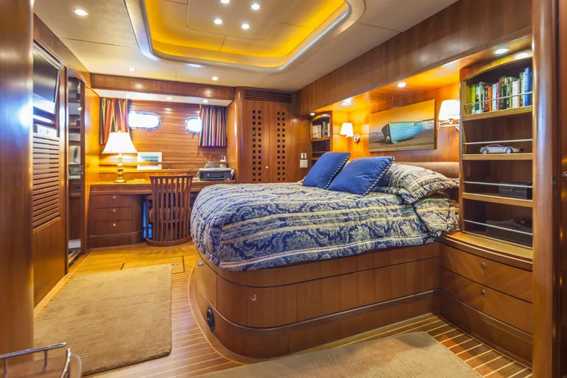 Ardreen Yacht Photos Pics Luxurious cabin interior of 2005 Selene 62 Ocean Trawler with wood finishes and cozy bedding.