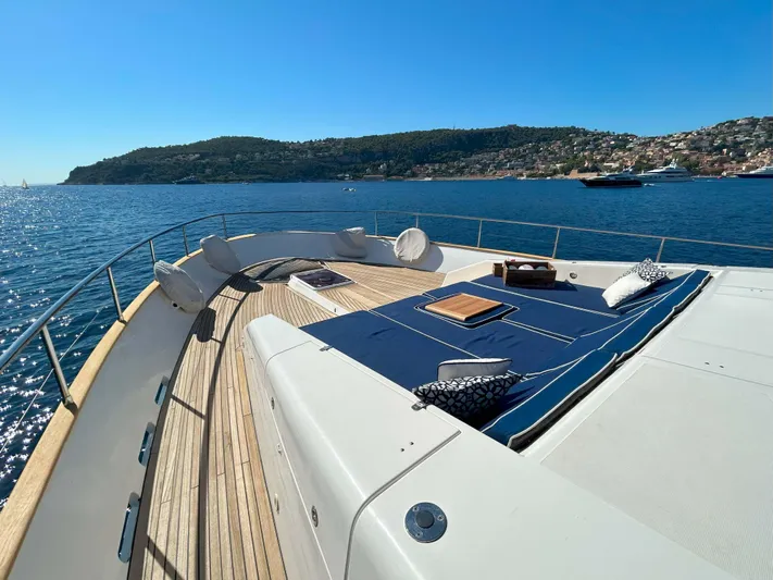 Lady Amanda Yacht Photos Pics Luxury 2006 Couach 2800 yacht deck with sunbathing area and scenic ocean view.