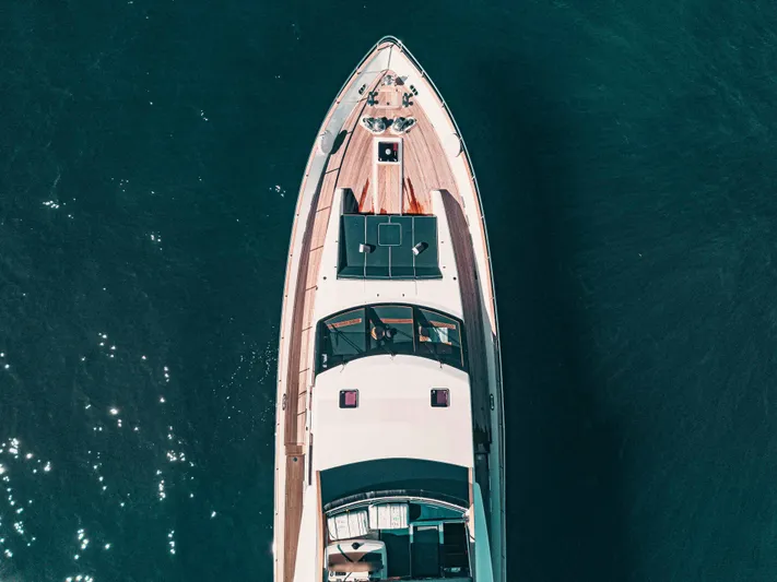 Lady Amanda Yacht Photos Pics Aerial view of 2006 Couach 2800 yacht on clear blue water.