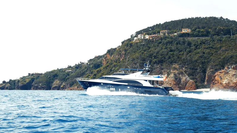 Lady Amanda Yacht Photos Pics Luxury 2006 Couach 2800 yacht cruising near scenic coastline.