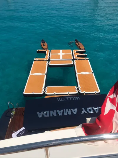 Lady Amanda Yacht Photos Pics Couach 2800 yacht with floating platform on turquoise water, 2006 model.