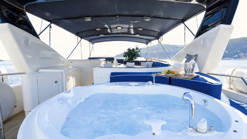 Lady Amanda Yacht Photos Pics Luxurious 2006 Couach 2800 yacht with jacuzzi and elegant seating area.