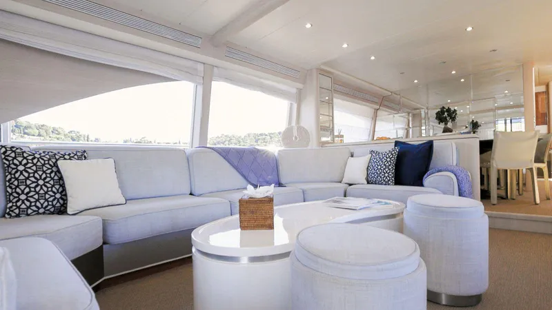 Lady Amanda Yacht Photos Pics Luxurious interior of 2006 Couach 2800 yacht with elegant seating and decor.