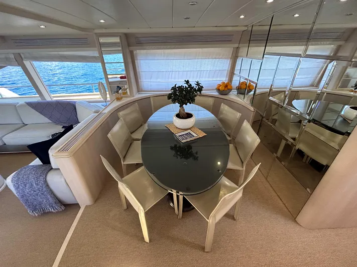Lady Amanda Yacht Photos Pics Luxurious 2006 Couach 2800 yacht interior with elegant dining area and sea view.