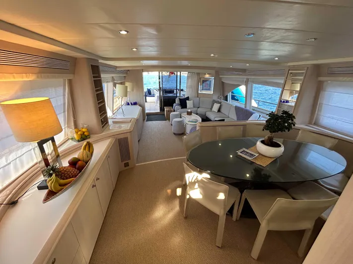 Lady Amanda Yacht Photos Pics Luxurious 2006 Couach 2800 yacht interior with elegant dining area and panoramic windows.