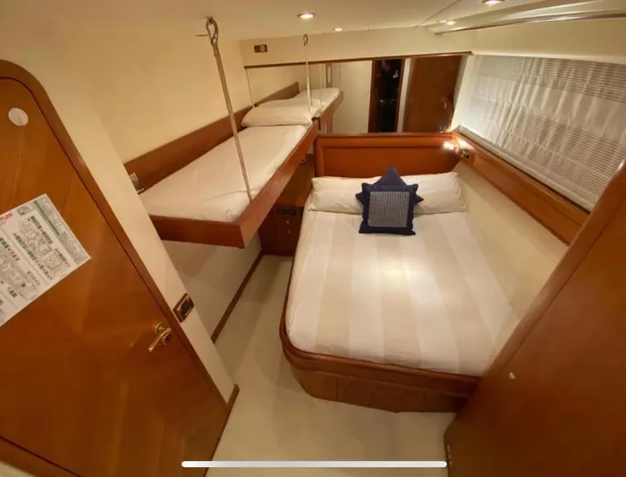 Lady Amanda Yacht Photos Pics Luxurious cabin interior of 2006 Couach 2800 yacht with cozy bedding.