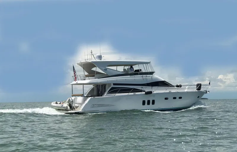 Amarone Yacht Photos Pics 2008 Neptunus 62 Motoryacht cruising on open water under clear skies.