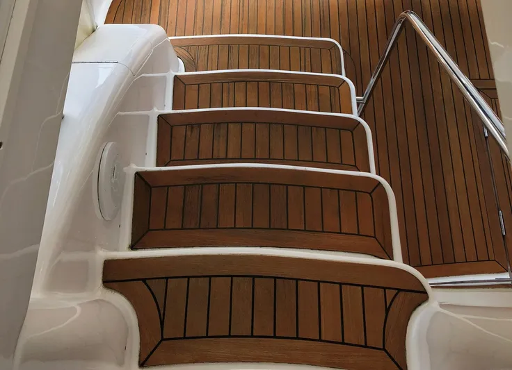 Amarone Yacht Photos Pics Teak steps on 2008 Neptunus 62 Motoryacht with stainless steel railing.