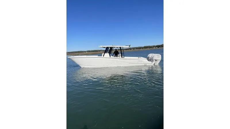  Yacht Photos Pics 2022 World Cat 400 CC-X boat on calm water under clear blue sky.