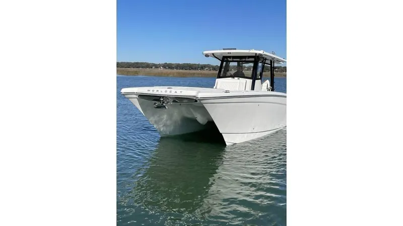  Yacht Photos Pics 2022 World Cat 400 CC-X boat on calm water under clear blue sky.