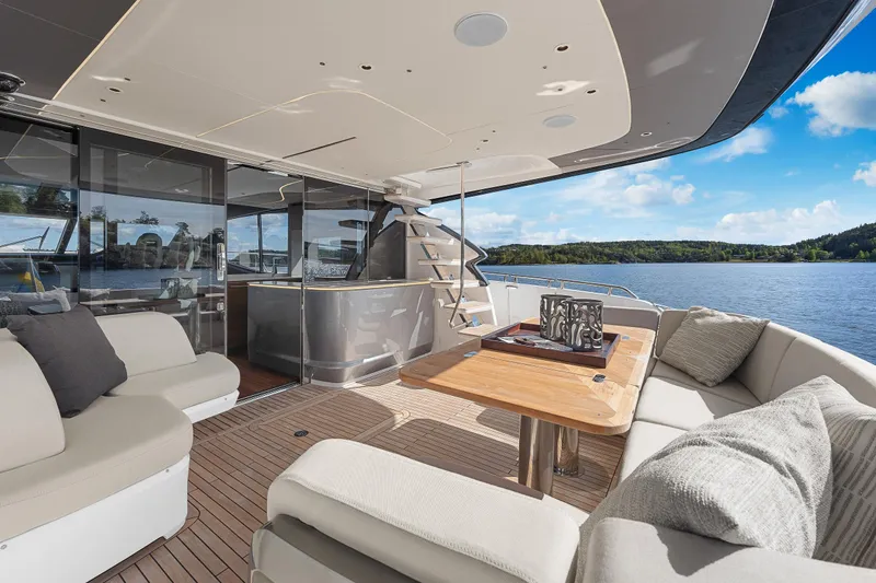 S72515 Yacht Photos Pics Luxurious 2023 Princess S72 yacht deck with elegant seating and scenic water view.