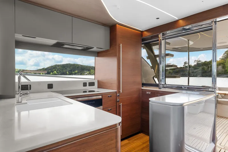 S72515 Yacht Photos Pics Luxurious kitchen interior of 2023 Princess S72 yacht with modern design and scenic window view.