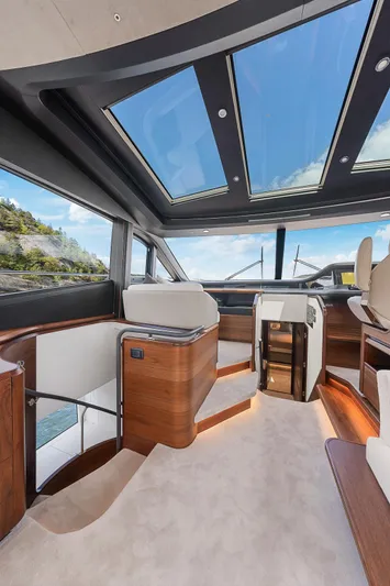 S72515 Yacht Photos Pics Luxurious interior of 2023 Princess S72 yacht with panoramic windows and elegant wood finishes.