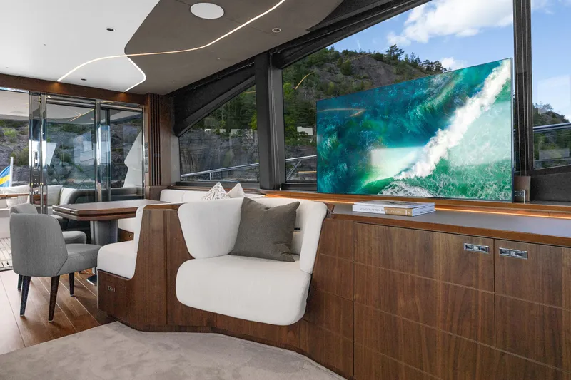 S72515 Yacht Photos Pics Luxurious interior of 2023 Princess S72 yacht with modern seating and large window view.