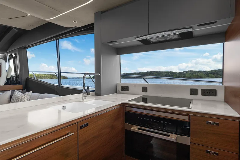 S72515 Yacht Photos Pics Luxurious kitchen interior of 2023 Princess S72 yacht with scenic water view.