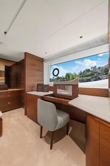 S72515 Yacht Photos Pics Luxurious interior of 2023 Princess S72 yacht with elegant wood finish and scenic window view.