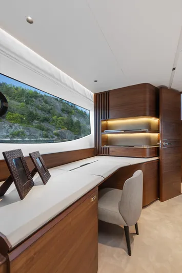 S72515 Yacht Photos Pics Luxurious interior of 2023 Princess S72 yacht with elegant wood finishes and scenic window view.