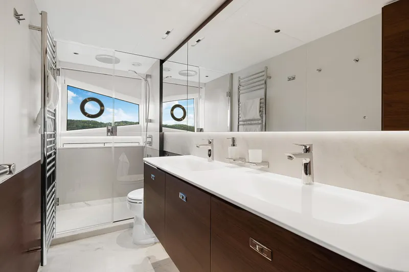 S72515 Yacht Photos Pics Luxurious bathroom in 2023 Princess S72 yacht with modern fixtures and ocean view.
