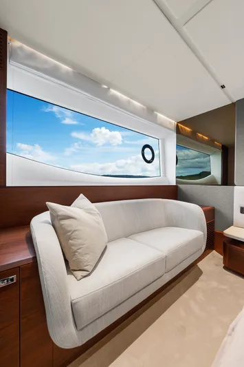 S72515 Yacht Photos Pics Luxurious interior of 2023 Princess S72 yacht with elegant sofa and scenic window view.