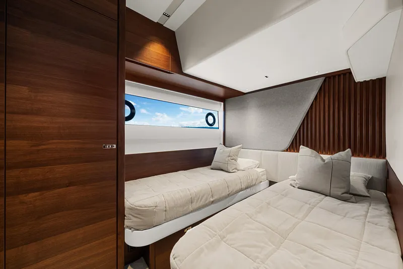 S72515 Yacht Photos Pics Luxurious cabin interior of 2023 Princess S72 yacht with twin beds and modern design.