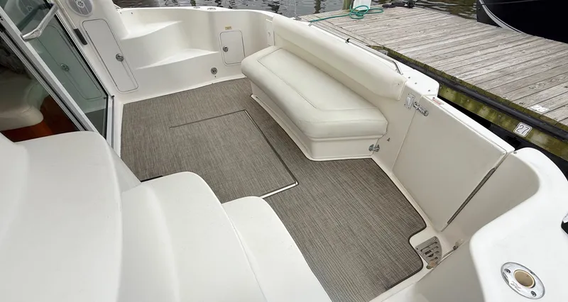 Messing About Yacht Photos Pics 2003 Sea Ray 400 Sedan Bridge boat interior with seating and carpeted deck.