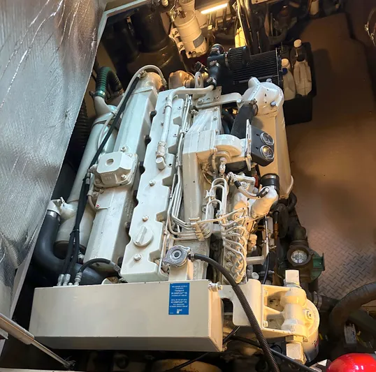 Messing About Yacht Photos Pics Engine room of 2003 Sea Ray 400 Sedan Bridge, showcasing detailed machinery and components.