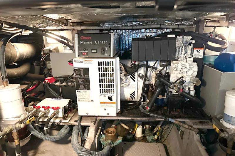 Messing About Yacht Photos Pics Engine room of 2003 Sea Ray 400 Sedan Bridge with Onan Marine Genset.