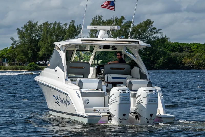Never Say Never Yacht Photos Pics 2021 Tiara Yachts 34 LX cruising on a scenic waterway with dual Mercury engines.