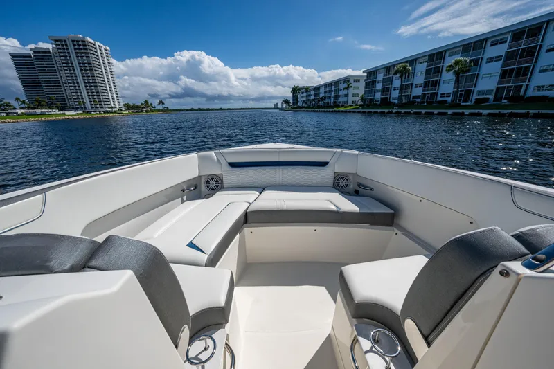 Never Say Never Yacht Photos Pics 2021 Tiara Yachts 34 LX interior with waterfront view and modern seating.