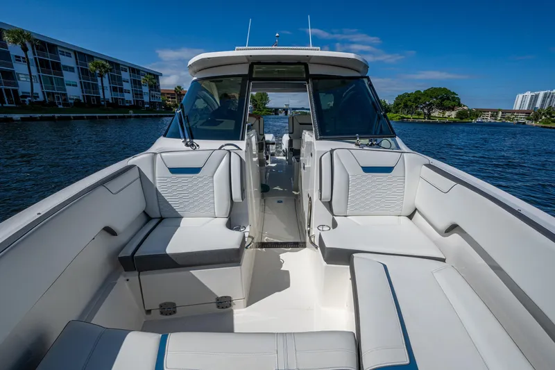 Never Say Never Yacht Photos Pics 2021 Tiara Yachts 34 LX boat interior with luxurious seating on a sunny day.