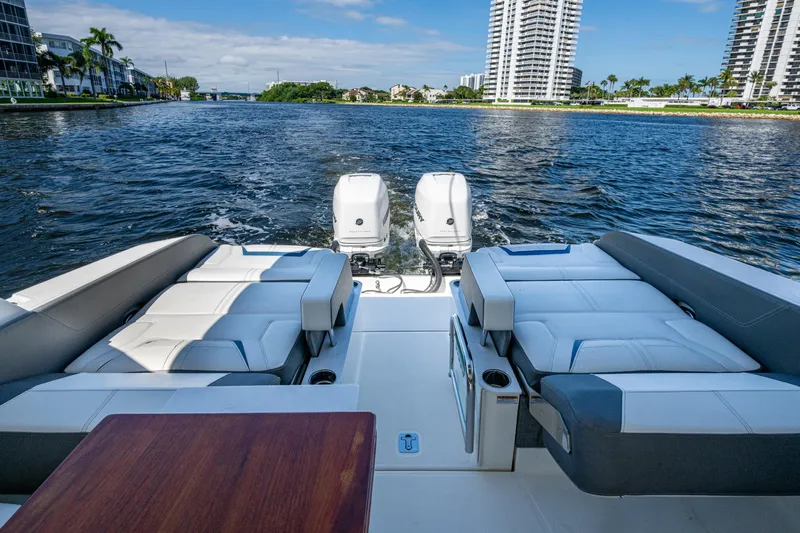 Never Say Never Yacht Photos Pics 2021 Tiara Yachts 34 LX on water, featuring luxurious seating and twin outboard engines.