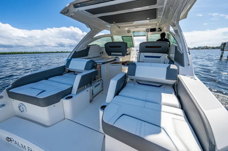 Never Say Never Yacht Photos Pics 2021 Tiara Yachts 34 LX luxury boat interior with seating on a sunny day.